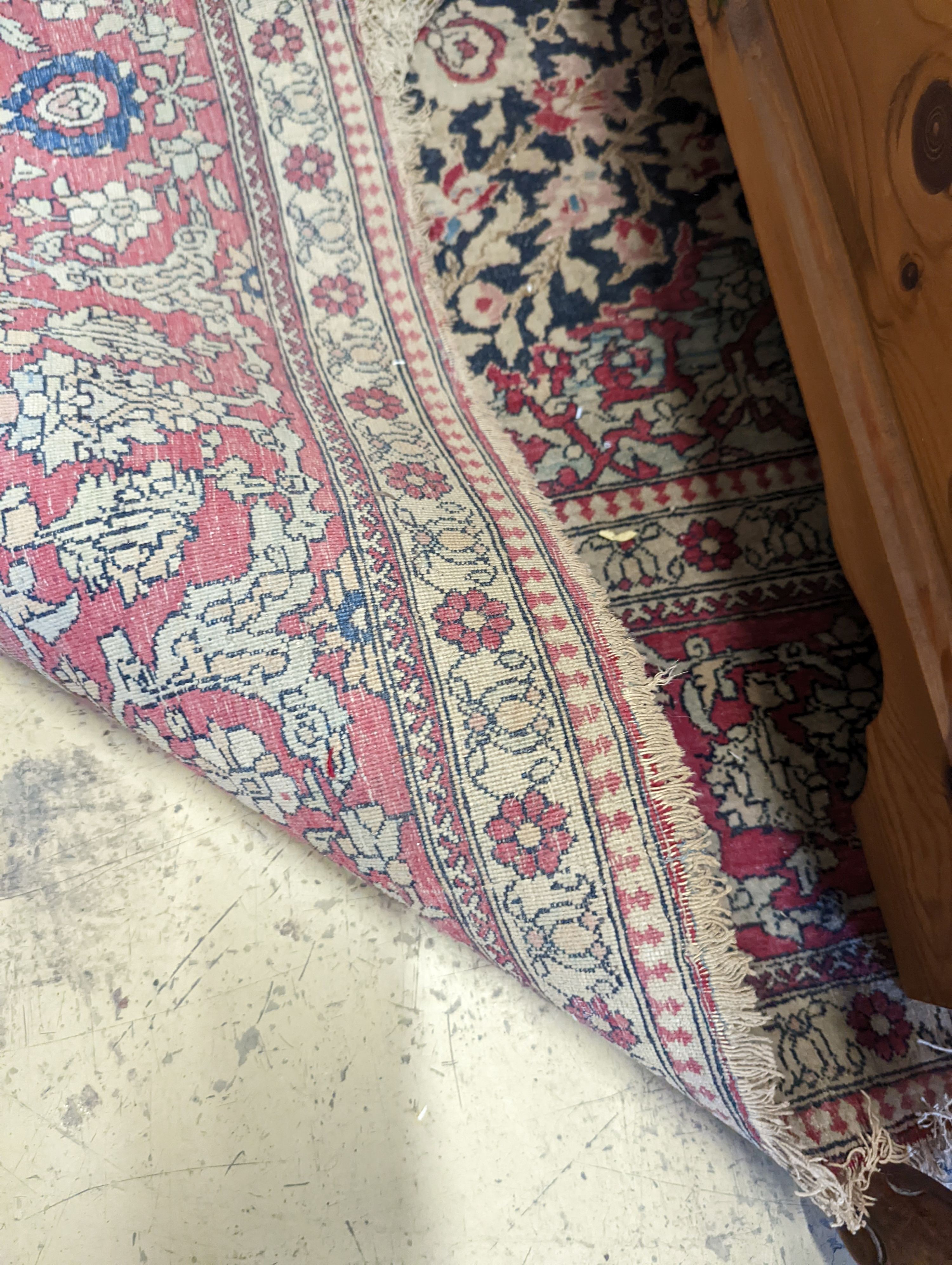 An Isphahan black ground rug with central foliate medallion, mulit-bordered, 202 x140cm